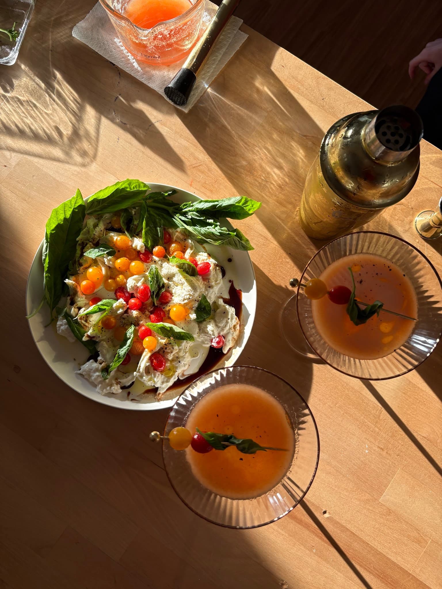 A fresh salad and drinks in the afternoon sun